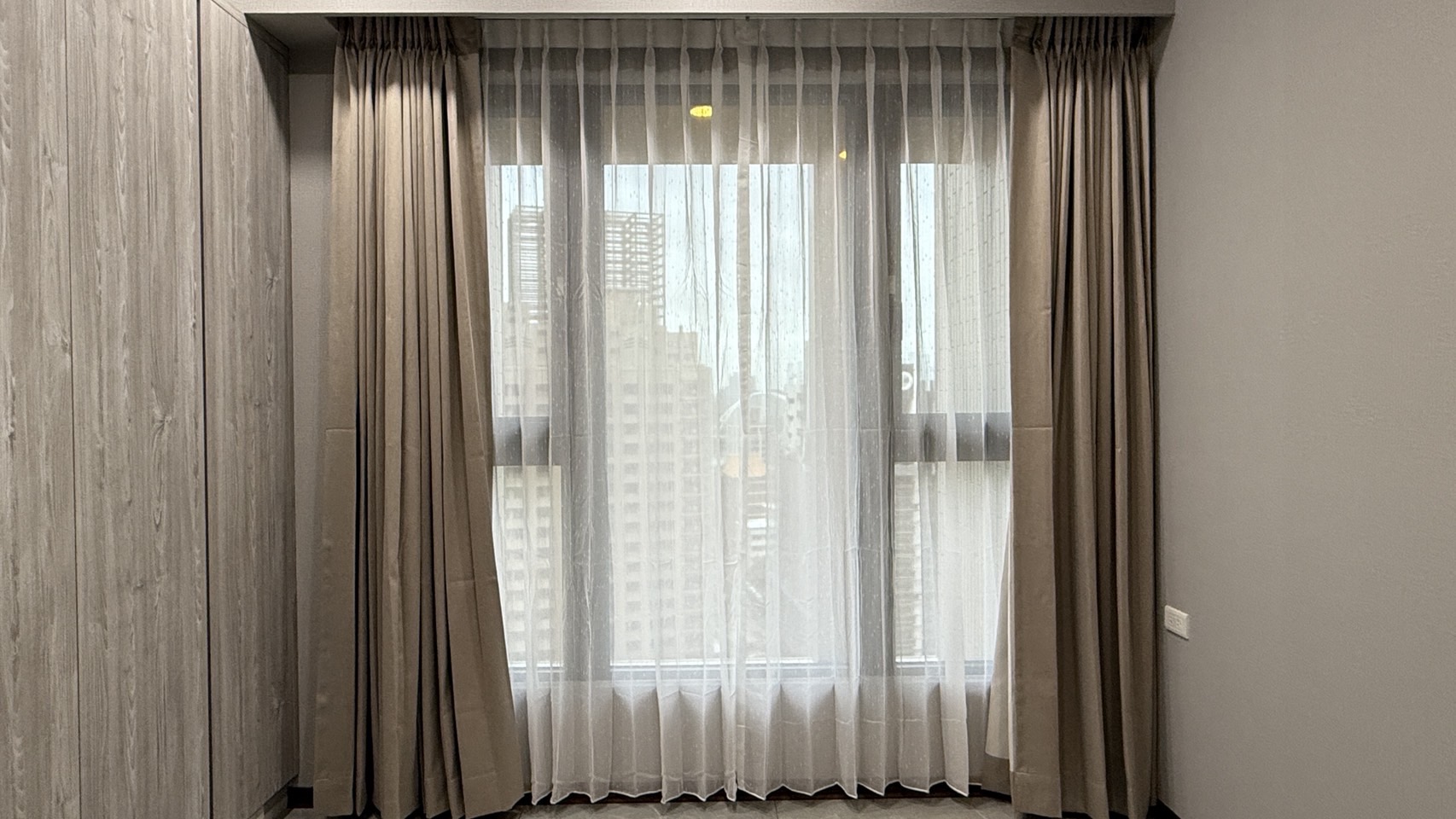 Residential interior featuring custom window treatments